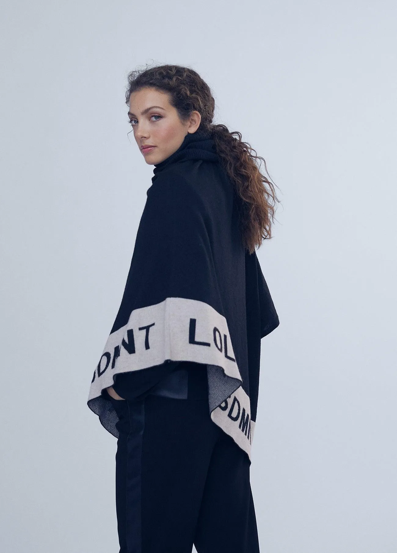 Asymmetric knit cape