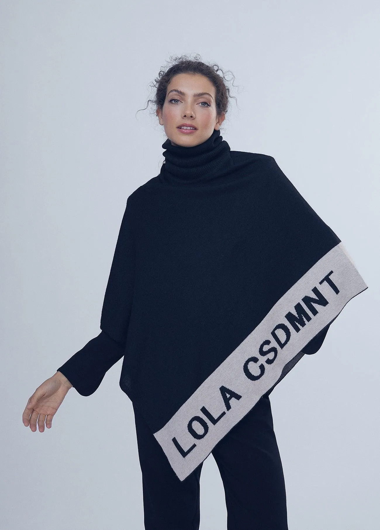 Asymmetric knit cape